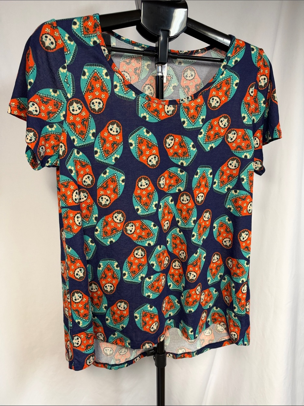 LuLaRoe Navy Short Sleeve Scoop Top with Orange & Teal Matryoshka Print